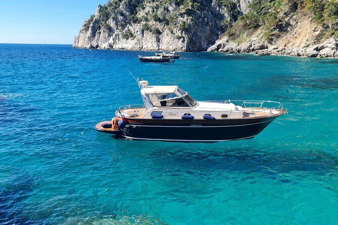 Capri Blue Grotto Small-Group Boat Day Tour From Sorrento - Cruising the Sorrento coast toward Marina Grande and Capri’s landmarks