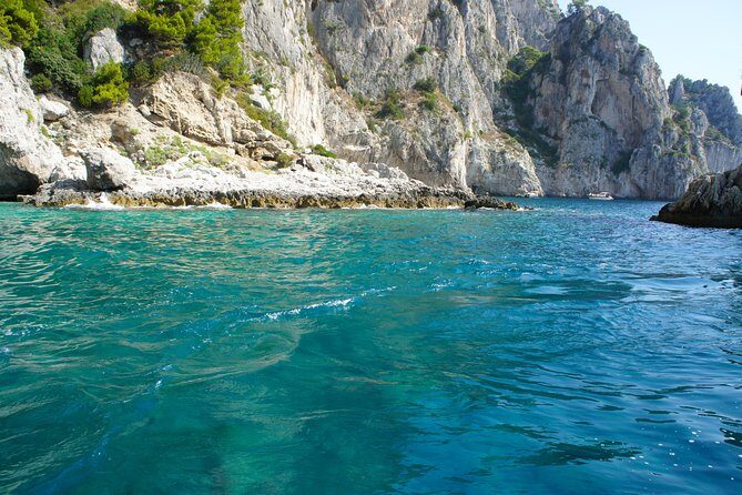 Capri & Blue Grotto Small Group Full-Day Boat Tour from Positano - Onboard comfort: Prosecco, drinks, towels, and sea-smart tips