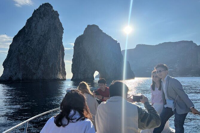 Capri Boat Tour and Blue Grotto Visit - Faraglioni, Casa Malaparte, and the Sirens Rock passes: the iconic Capri stuff done right