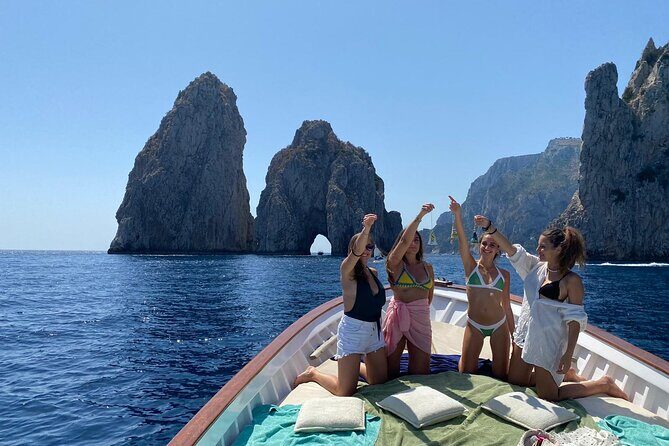 Capri Boat Tour: Grottoes, Swim & Sip Limoncello in a Small Group - Faraglioni and the Arch of Love: The Photo Stretch