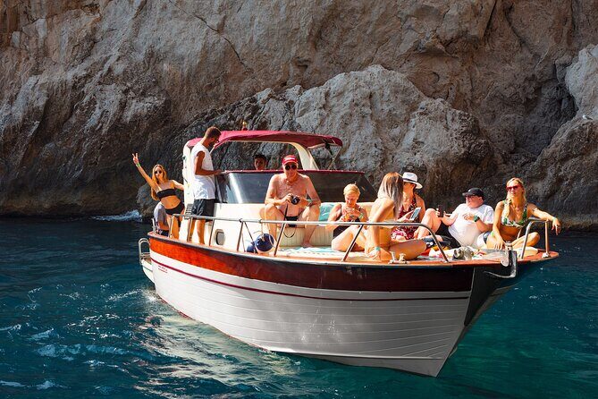 Capri Guided Boat Experience with Island Exploration and Transfer - Faraglioni Rocks and the Natural Arch: viewpoints with real context