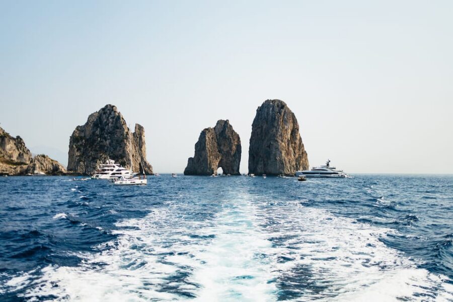Capri: Island Boat Tour and Optional Blue Grotto Visit - Group experience and the guide/skip-per factor