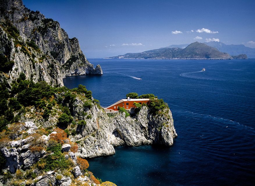 Capri: Island Boat Tour with Blue Grotto Stop - Grotta Bianca and Arco Naturale: cliffs, openings, and visual clues