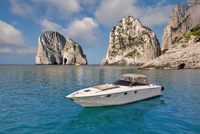 Capri Premium Boat Tour and City Visit Free Bar and Aperitif - I Faraglioni close-up: photos, legend, and the famous rocks