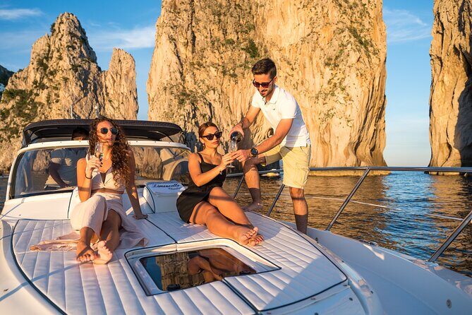 Capri Private Boat Tour with Limoncello tasting - Stop 3: I Faraglioni Swim Time Under the Rock Icons