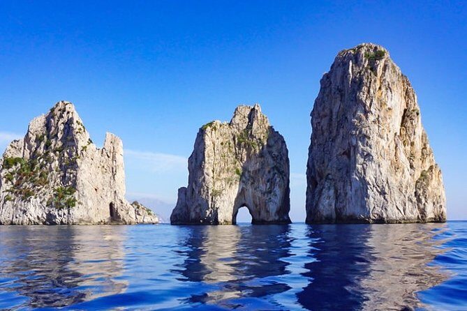 Exclusive Private VIP Capri Boat Experience on a Gozzo - Cruising Capri’s coastline with a skipper who can read the day
