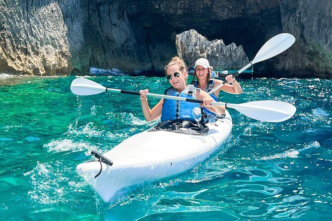 Kayak tour in Capri between caves and beaches. Photos included. - What the Photos Feel Like in Real Life