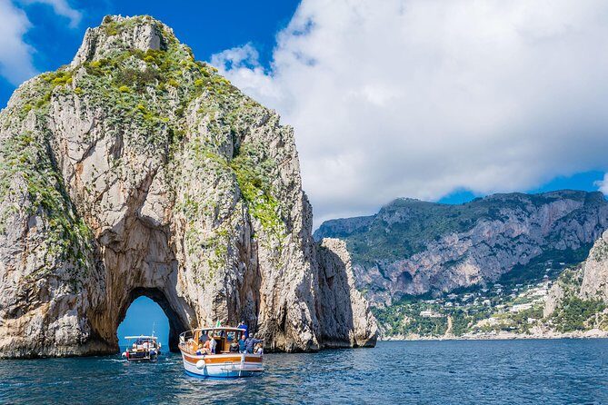 Li Galli Islands and Capri Small Group Boat Tour from Amalfi - Capri from the sea: Faraglioni views and a chance to snorkel-style swim