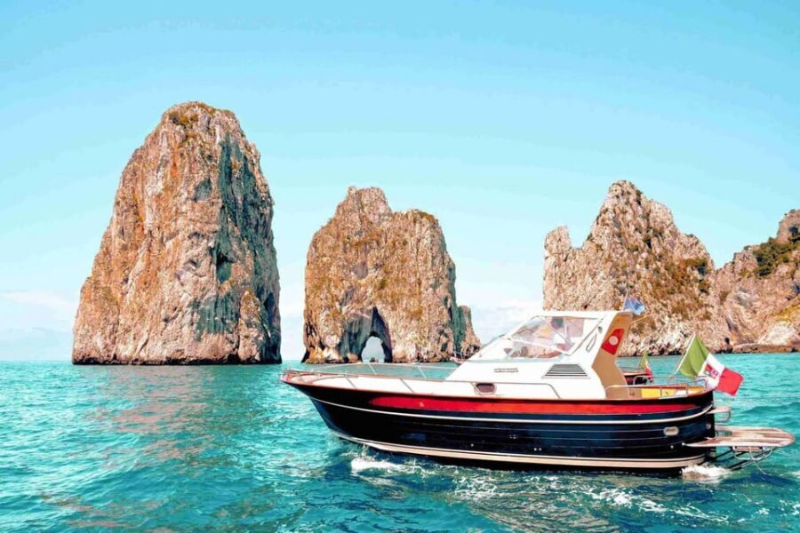 Positano: Capri and Blue Grotto Shared Boat Tour with Drinks - Heading for Capri: what the boat ride adds to the day