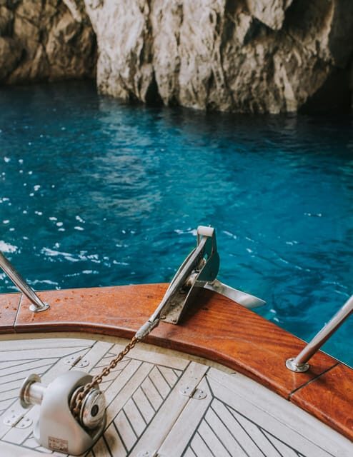 Positano: Capri and Blue Grotto Shared Boat Tour with Drinks - Return to Positano with limoncello tasting