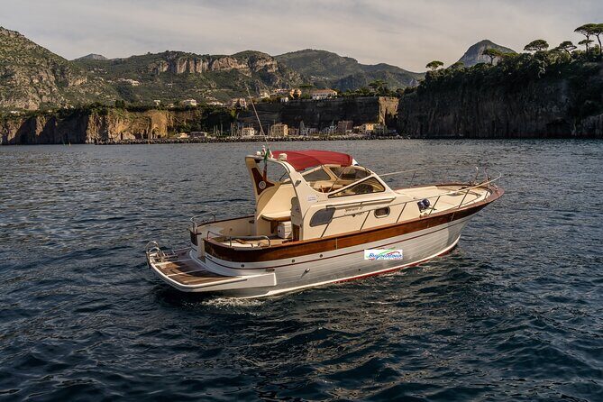 Private Boat Tour from Sorrento to Capri on a Classic Gozzo 8.50 - Past the Faraglioni: iconic rocks and a fun tradition