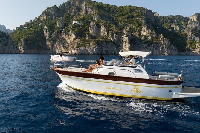 Private Boat Tour To Capri Departing From Positano - Faraglioni to Li Galli and the ride back with limoncello