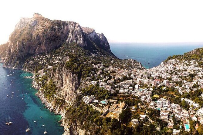 Private Capri Luxury Boat Experience: Cruise, Swim & Sunbathe - Service that makes it feel private: skipper hosting, snacks, and family comfort