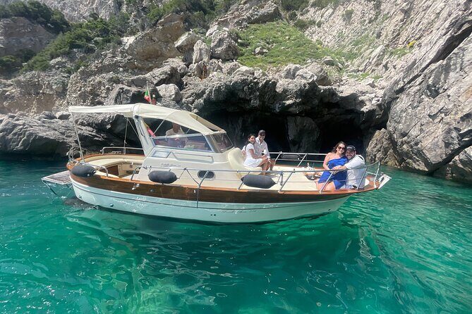 Three Hour Private Guided Tour of Capri with a luxury Gozzo cabin cruiser - I Faraglioni: the signature photo moment with the right angle